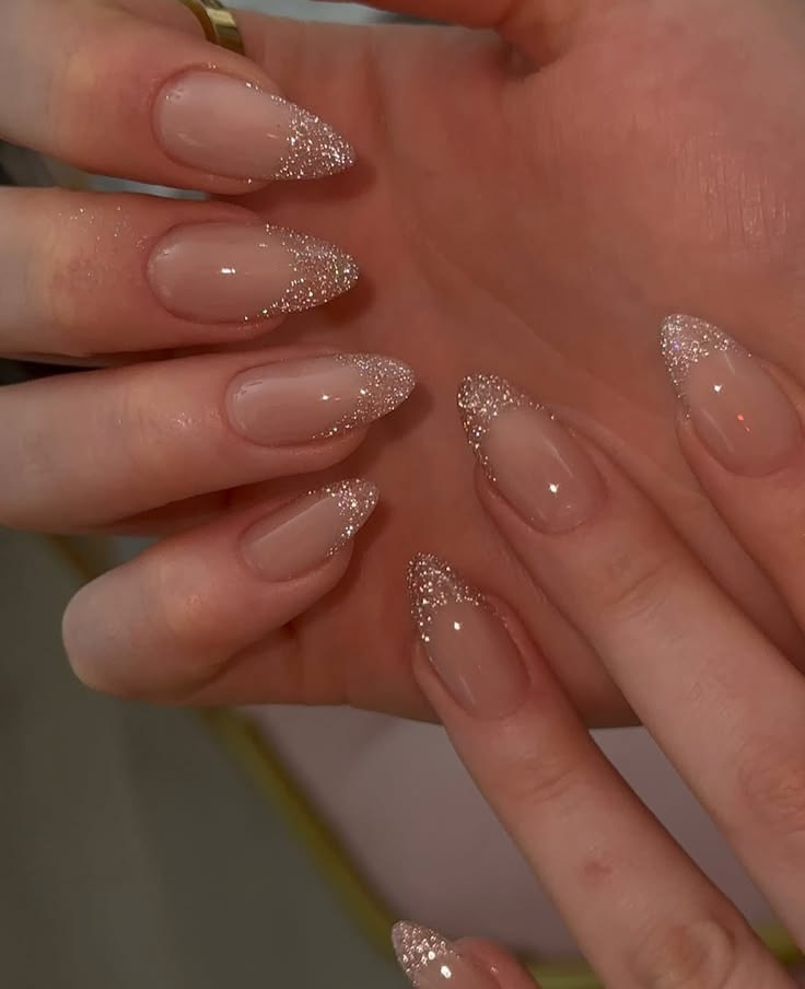 Glitter-tipped almond nail extensions